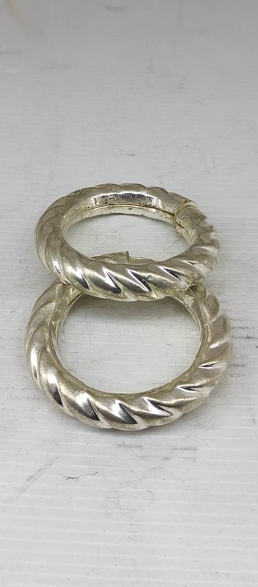 "Bold handcrafted bangle pair with curved tribal design–artificial metal finish-for foreign trade"