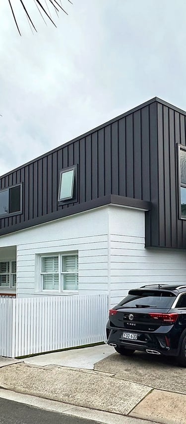 Award-winning Sydney architecture blending brutalist geometry with coastal Hampton-style warmth.