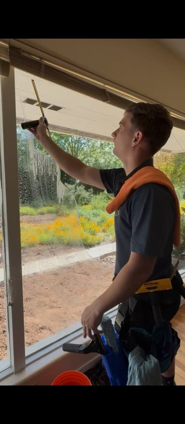 this is a picture of me cleaning a window