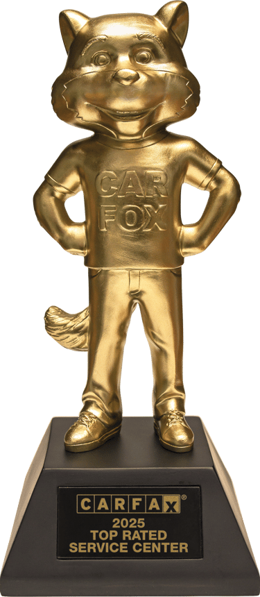 Gold CARFAX 2025 Top Rated Service Center trophy featuring the Car Fox mascot on a black base.