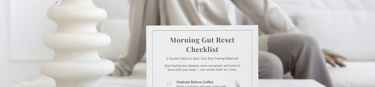 Printable gut health reset checklist with a woman sitting on a bed, supporting digestive wellness an