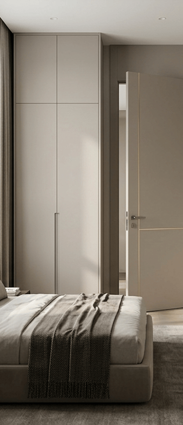 Modern minimalist bedroom featuring a sleek greige built-in wardrobe and matching gold-inlay door.