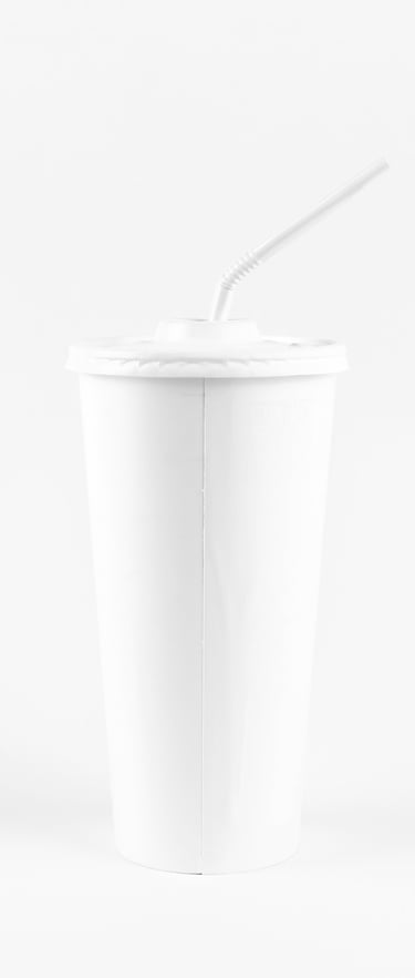 a white cup of soda with a straw