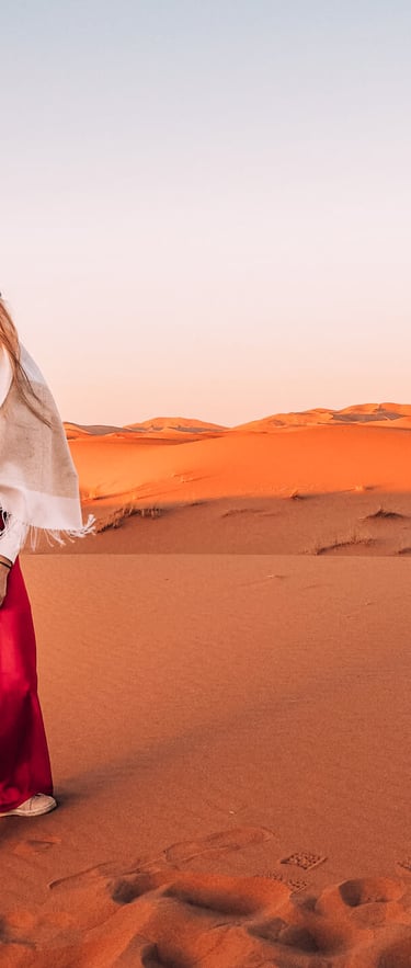 a woman in a white shirt and red pants