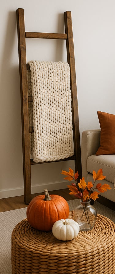 a rustic wooden ladder draped with a chunky knit blanket beside a beige sofa