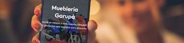 a person holding a cell phone in their hand