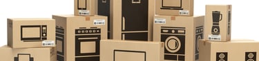 a group of cardboard boxes with a computer monitor and a monitor