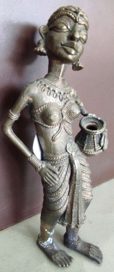 "Handcrafted tribal woman statue holding a water pot, standing in elegant pose-Globally tradable"