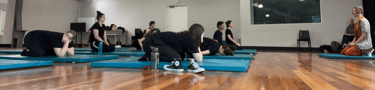 a group of people in a gym room