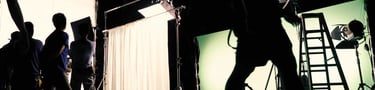 Film Crew sets up a green screen, working on a production funded after using Stelarator's marketplace tools