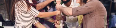 Group of working colleagues doing a collective skill game in an internal team event