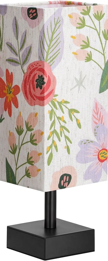 Modern square table lamp with a colorful floral fabric shade on a sleek black metal base.