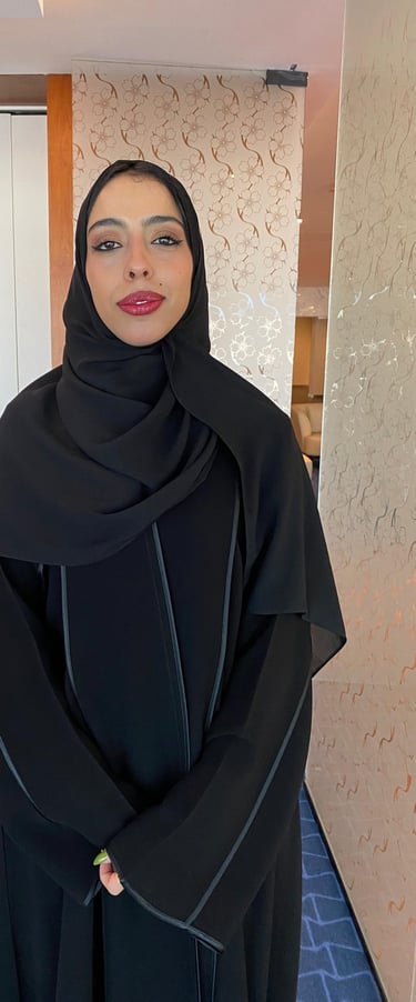 a woman in a black dress and a black dress