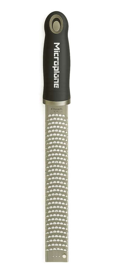 Microplane stainless steel zester grater with black handle on a white background