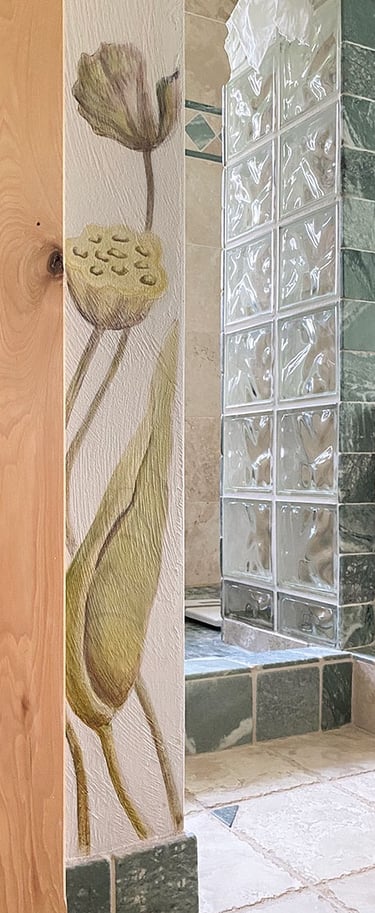 Detail of spa bath mural with 2 painted lotus seed pods on corner wall.