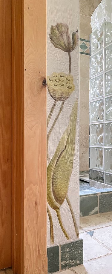 Detail of spa bath mural with 2 painted lotus seed pods on corner wall.