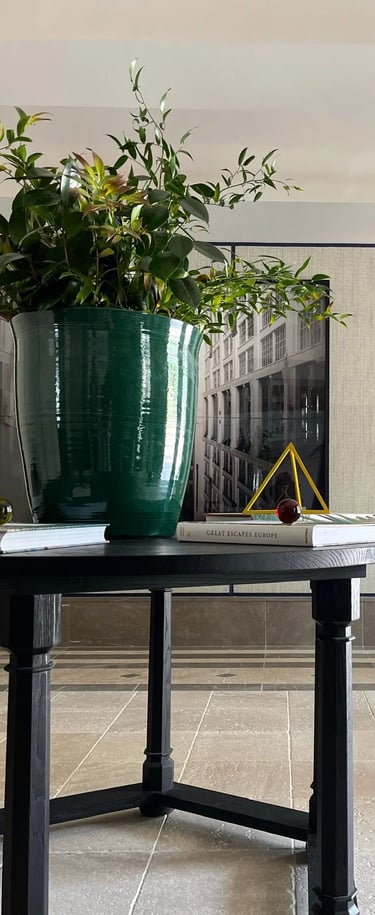 Entrance foyer at Villa La Gratitud with sculptural console and fresh florals