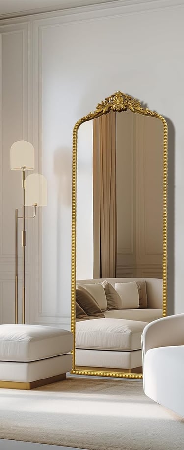 Elegant gold full length floor mirror in a luxury minimalist living room with white furniture.