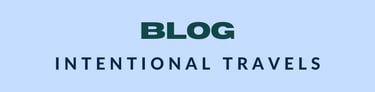 Minimalistic blog banner for 'Intentional Travels' with bold green text on a light blue background, 