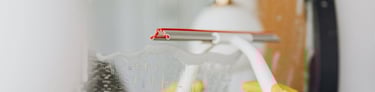 wiping mirror during home cleaning service