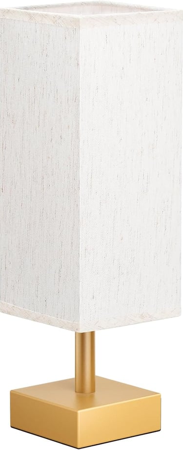 Modern minimalist table lamp with a tall white fabric shade and a square gold metal base.