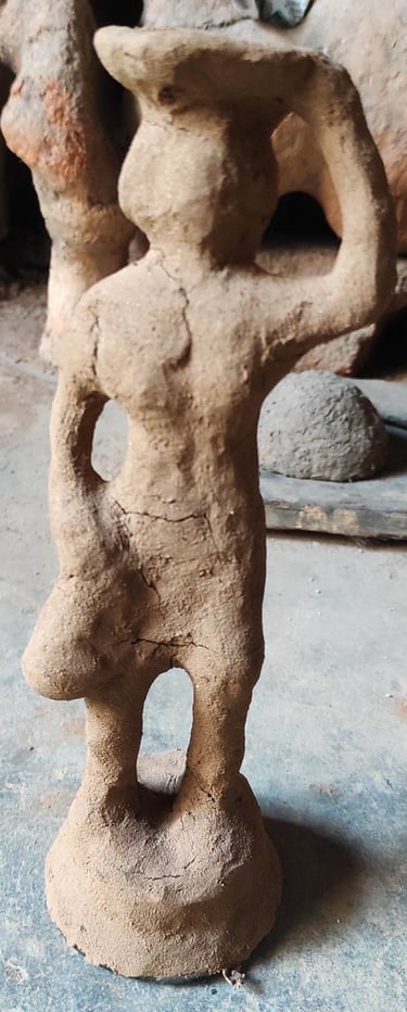 "Special clay layered over wax model in the Dhokra brass art process by tribal artisans of Bastar, Chhattisgarh"