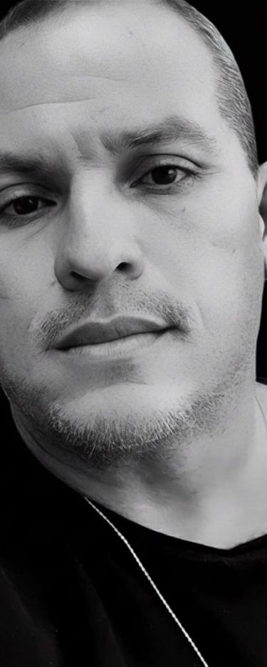 a man with a necklace and a necklace with a star on it