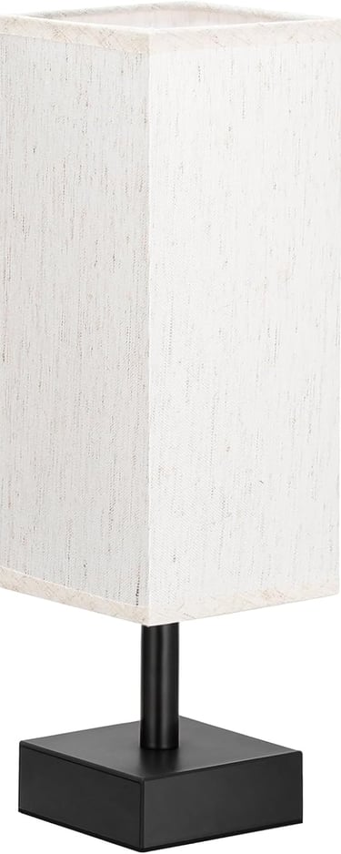 Modern bedside table lamp with a black metal base and a tall white fabric rectangular shade.