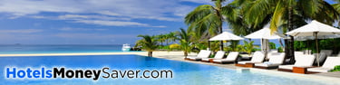 Beach Front Swimming Pool, Sunbeds, Parasols, with Palm Trees and Blue Sky