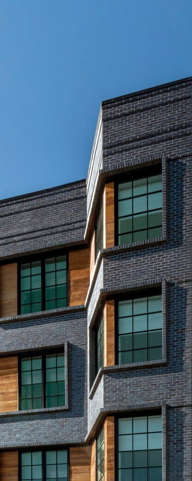 An architectural photo of a brick building with an angle