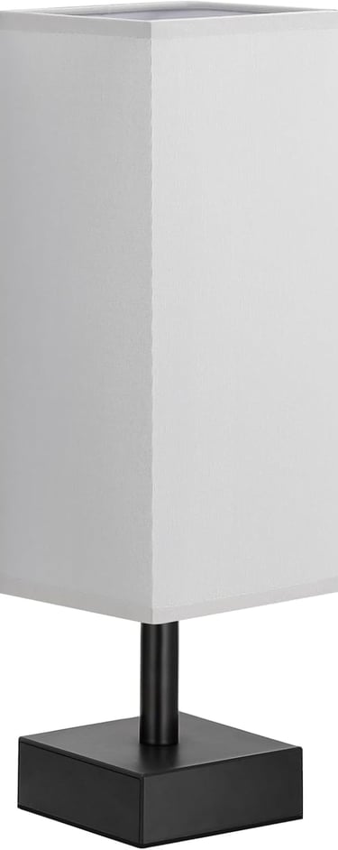 Modern minimalist table lamp featuring a tall white fabric square shade and a black metal base.