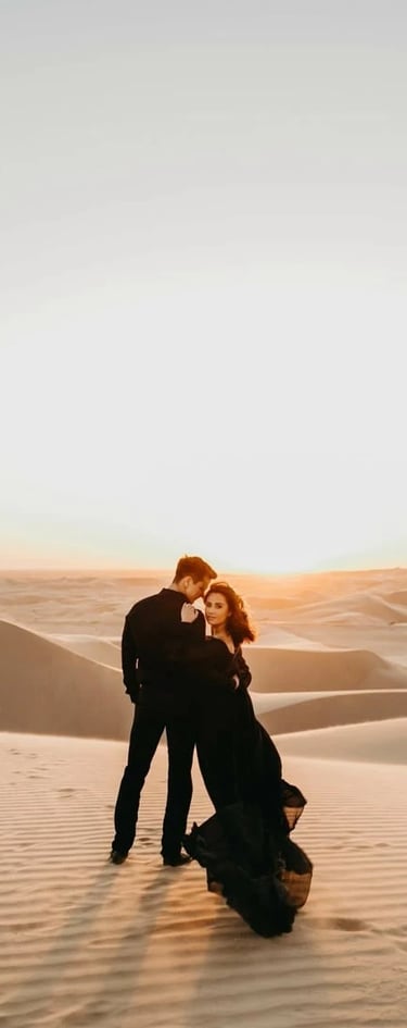 a couple kissing in the desert
