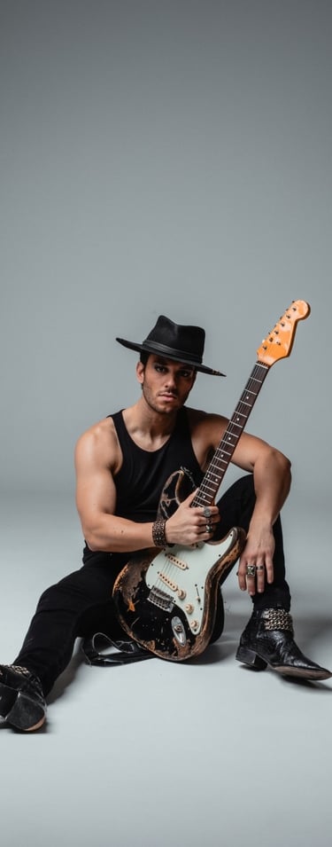 a vocalist in a hat with a guitar