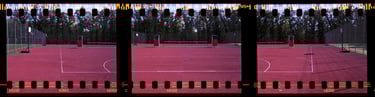 Composed photo of a vibrant red outdoor multipurpose sports court with crisp white markings