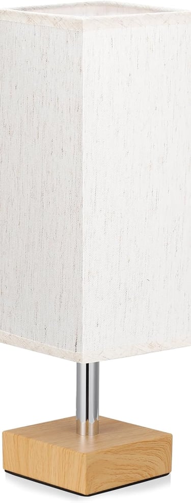 Modern square table lamp with a white fabric shade and light wood base.
