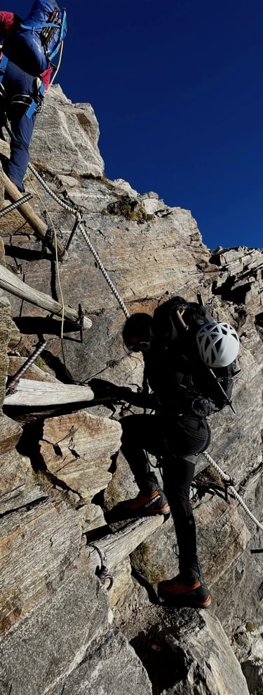 mais alhajri climbing a rocket mountain using a via ferrata route