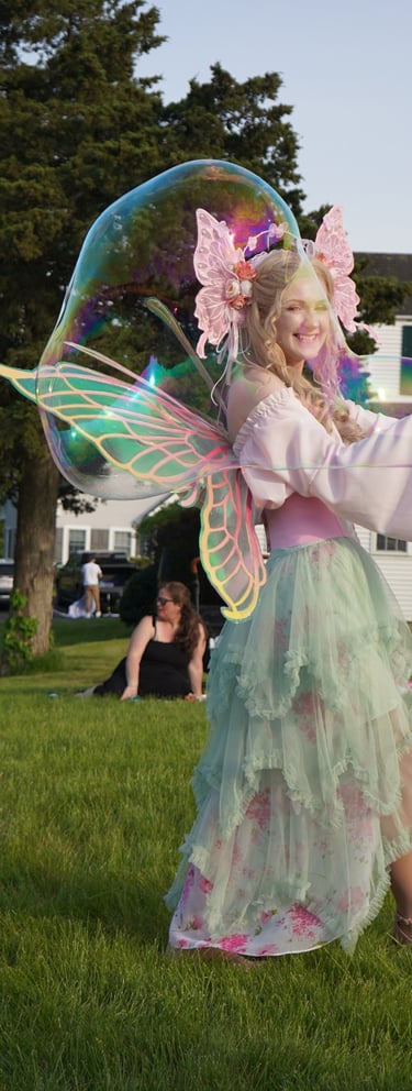 Bubble fairy making bubbles for guests