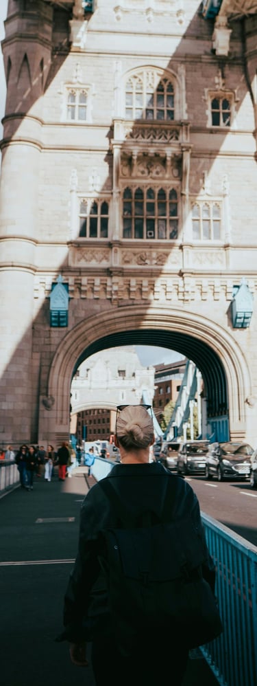 a person walking across a bridge over a bridge