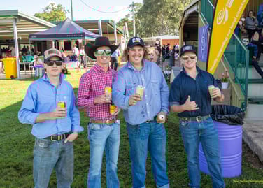 Four men enjoying the Nanango Races
