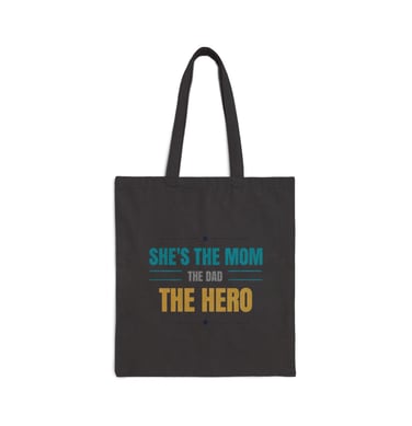 a black bag with she's the hero she is the hero she is the