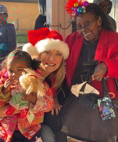 Angie Crouch with Mama Hill at annual Christmas Party for children in Watts