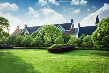 a large house with a lawn and a lawn