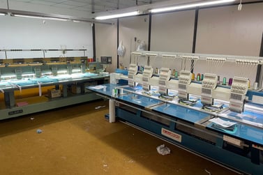 a large number of sewing machines in a factory