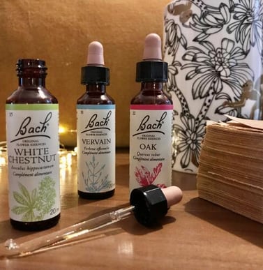 a few bottles of whitening oils on a table