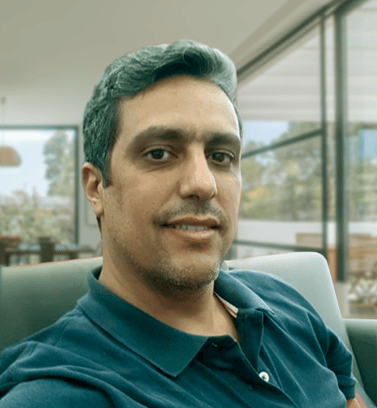 a man with a green hair and a blue shirt