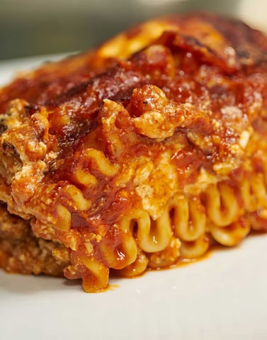 a piece of pasta with pasta and cheese sauce