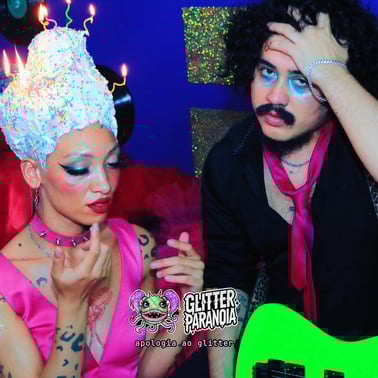 a man and woman in a party hat and a guitar