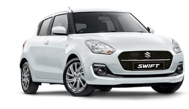 a white suzuki swift swift parked in front of a white background