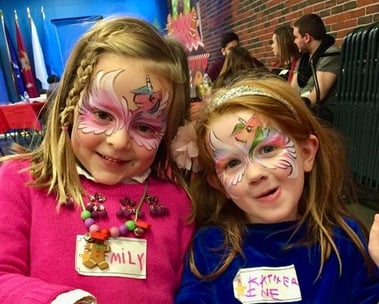 Two Unicorn Mask Face Paintings at a Holiday Event in Las Vegas
