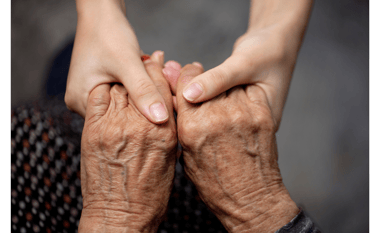 a woman holding her hands together in a hands